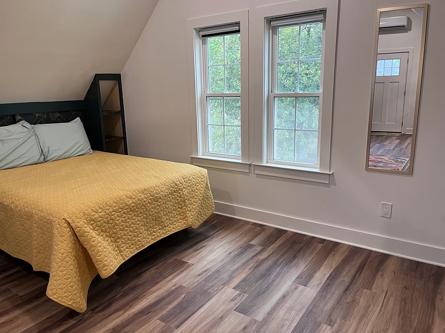 Pass through storage behind the queen bed, and built in shelving to frame the mattress.  All windows have black out blinds.