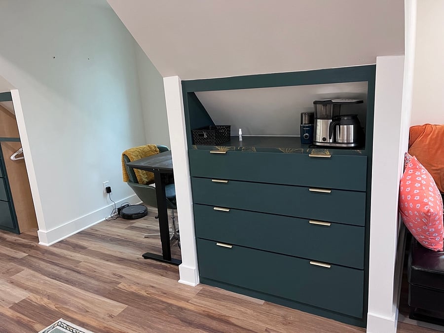 The drawers are tapered here so that the bottom drawers are much deeper than the top two drawers.  All  extra kitchen utensils and appliances are stored here.