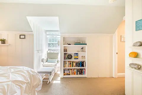 Lots of natural light and a comfortable chair for reading or studying.