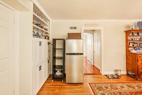 This fridge and storage shelf in the dining room are for you to use during your stay.