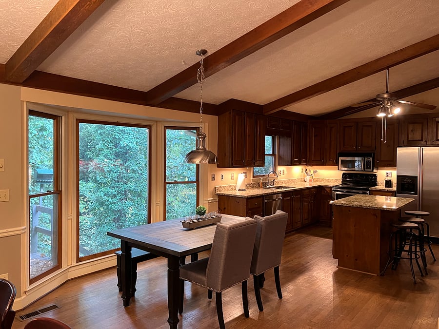 Open floor plan living area with opening to breakfast area and kitchen