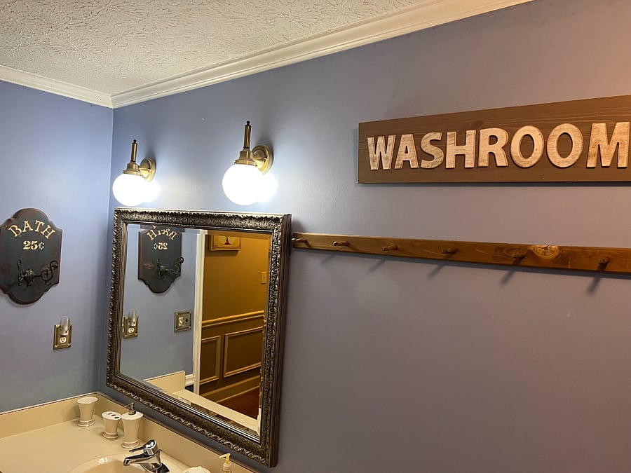 Hall bathroom accessible via hall and through bedroom 3
