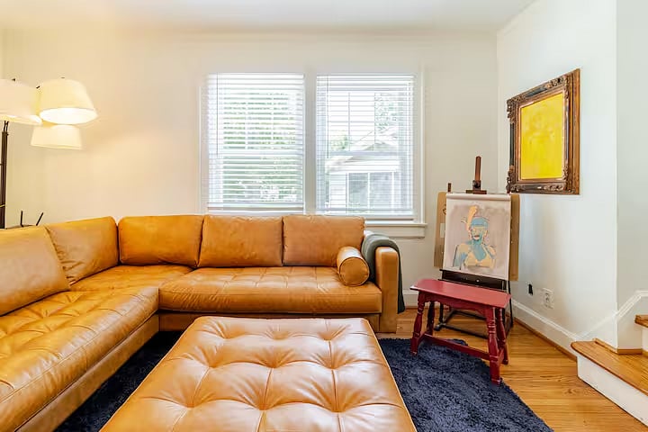 The living rooms strikingly simple and bold color palette is enhanced by the natural light.