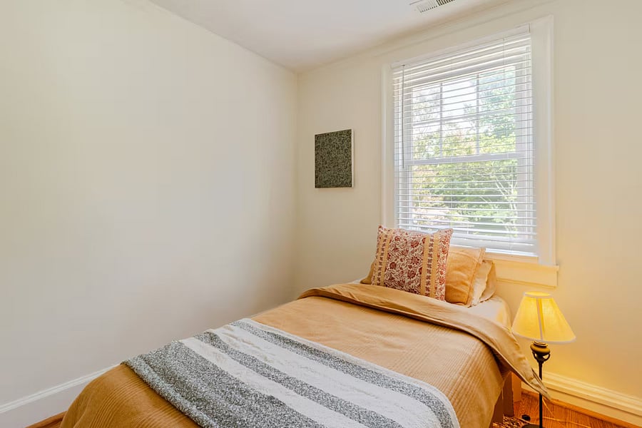 We've recently added a bedside table to this room, which is not shown in the photos. The warm lighting and ultra-soft throw blanket make it an ideal spot for a relaxing nap. There is also a closet in this room to store your luggage. 