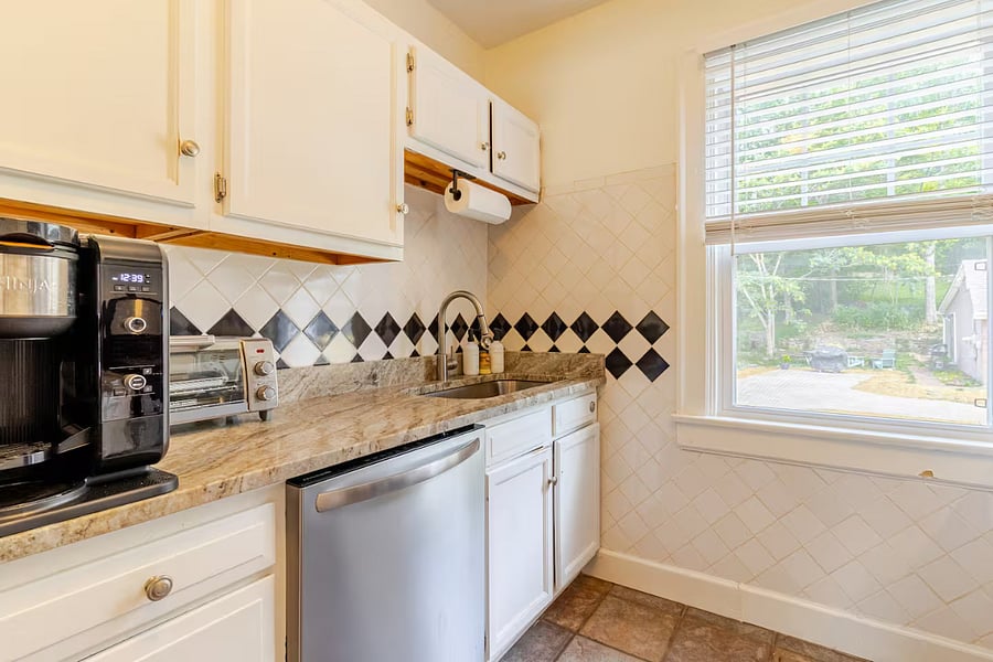 Youll love cooking in our fully stocked kitchen, equipped with pots, pans, and knives in various sizes, an air fryer/toaster, a Ninja coffee maker, stainless steel appliances, a gas stove, an over-the-range microwave, and a spacious full-basin sink.