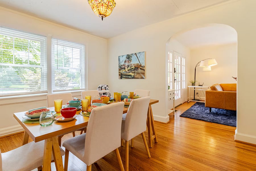 Savor every meal at our brand-new oak dining table with cushioned seating, designed to accommodate a group of six. A high chair is also provided for your little one. Enhance your dining experience surrounded by original artwork.