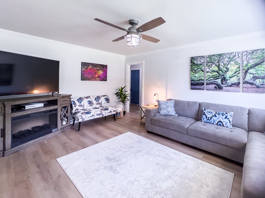 living room with 65" smart tv and fireplace