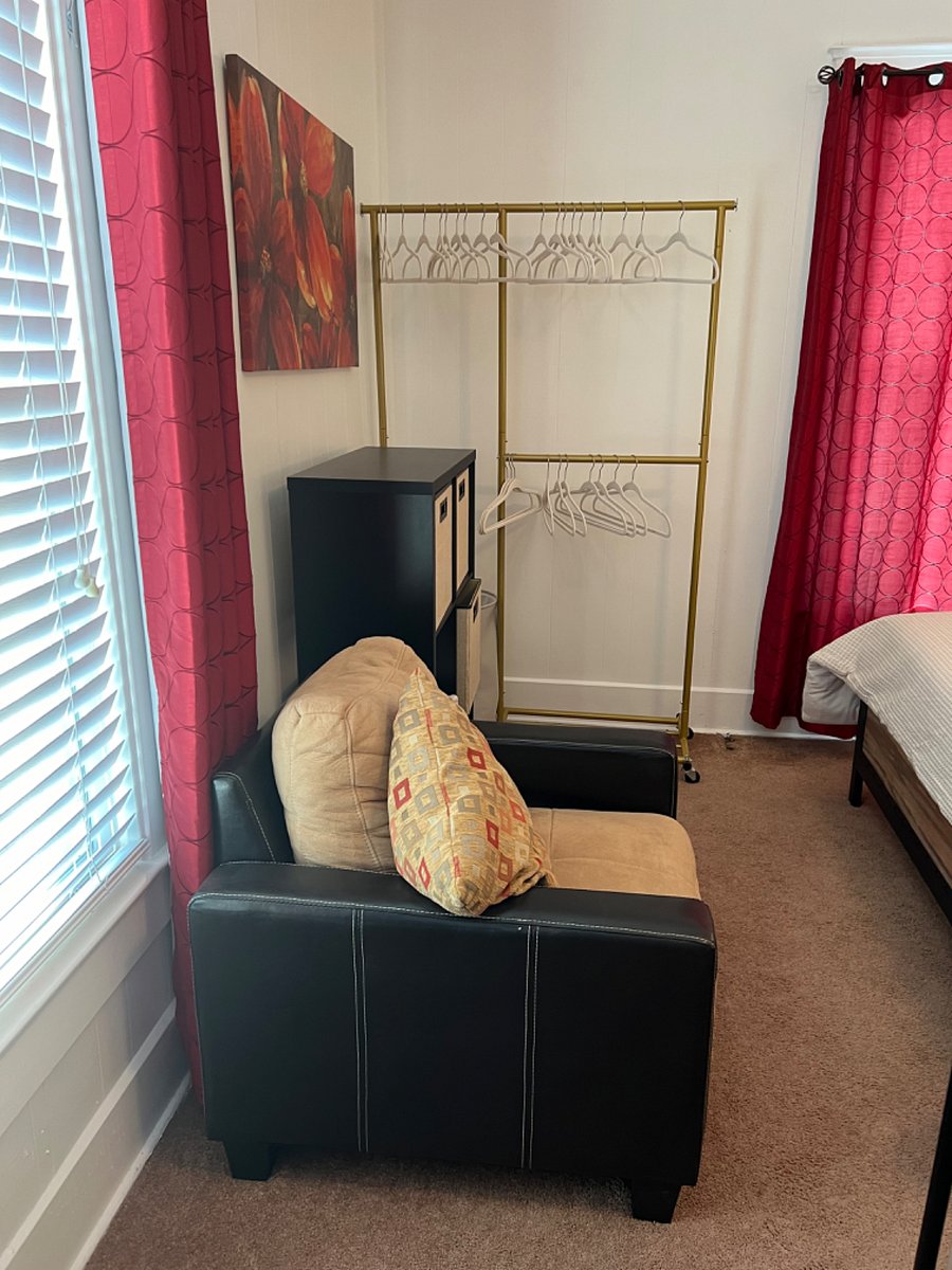 Storage bin case and clothes rack. Second bedroom shared with study/TV room