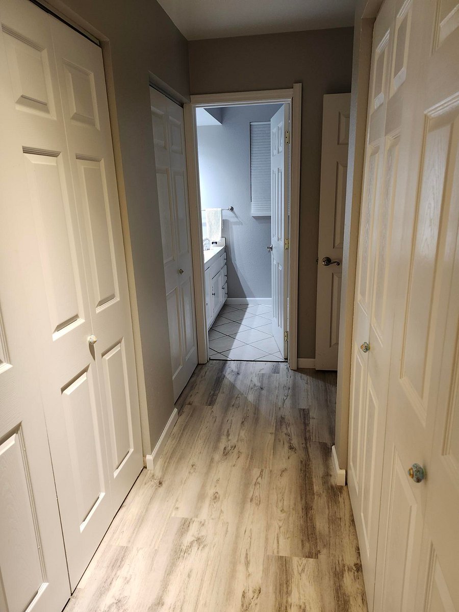 Hallway leading to bathroom @ Bedroom # 1. Complete with 2 full size 6' closets with bi-fold doors.