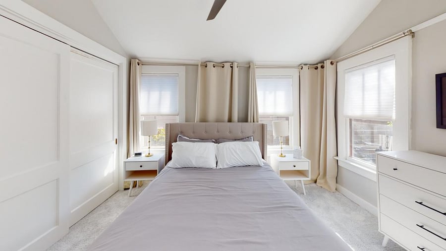 Back Master Bedroom with lots of lights. It does have blinds for when it is time to sleep.