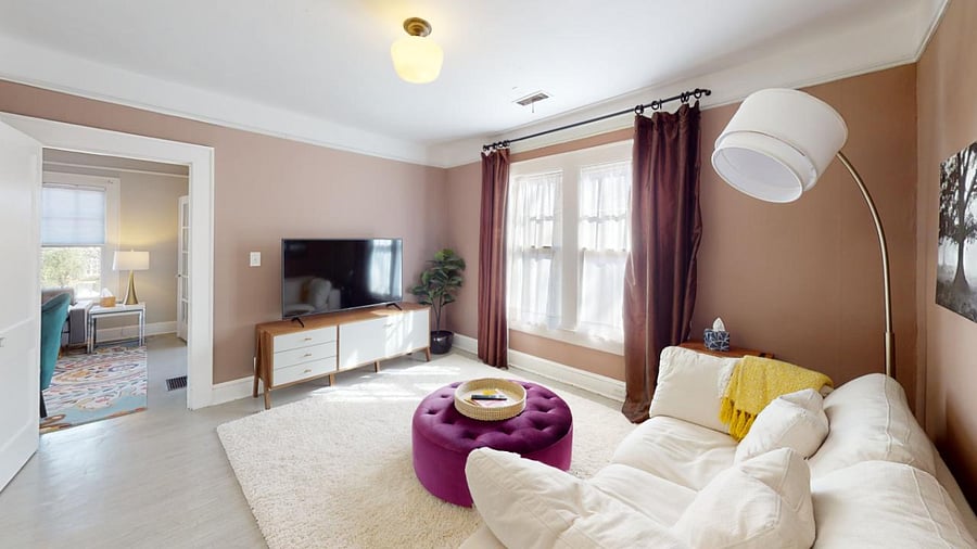 TV Room with pictured access to family room where the front entrance comes in