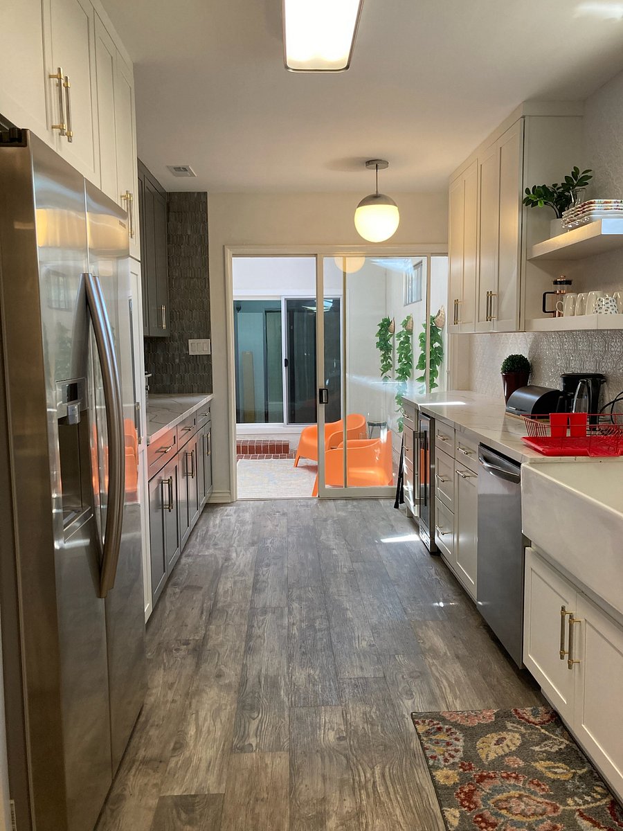 Galley kitchen with view of solarium.