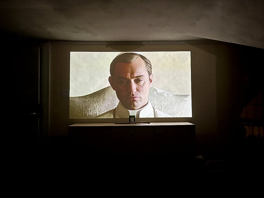 Living room projector system works well in the daytime and at night.