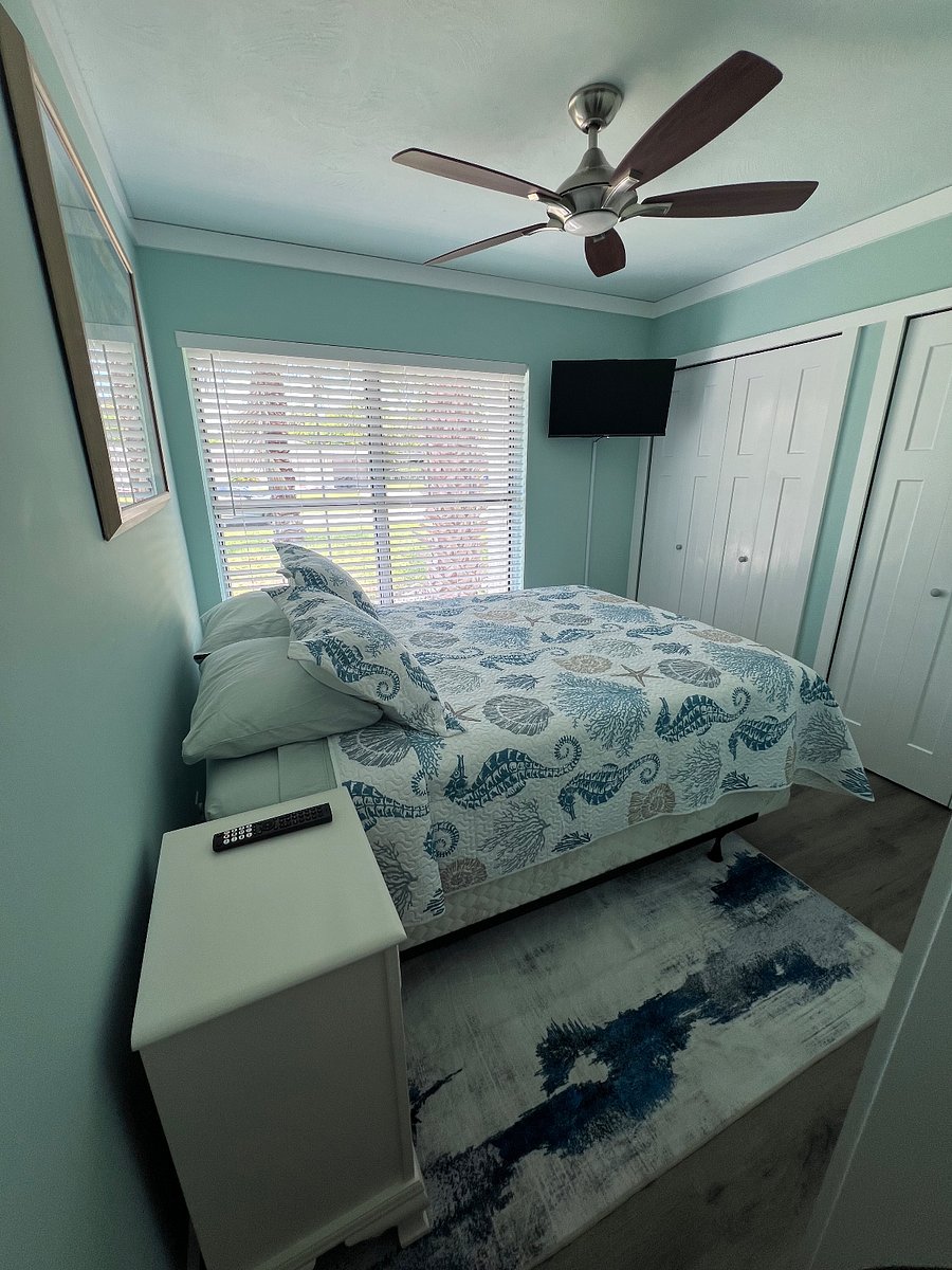queen bedroom with smart TV