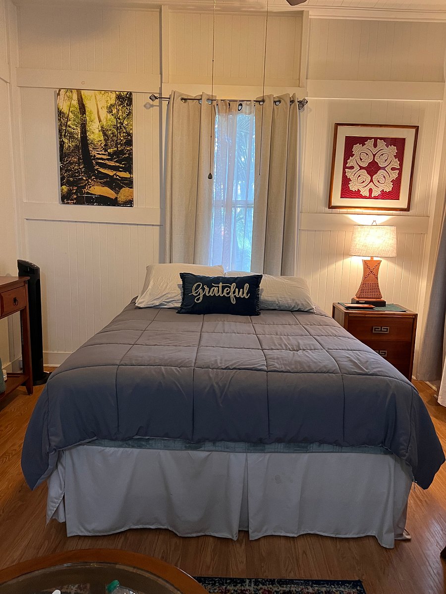The Queen Bed with windows at the head and left side, allows the trade winds to gentlyThe  blow in!