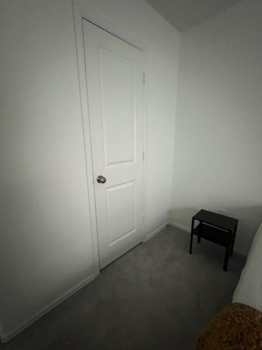 Closet in bedroom with hangers.