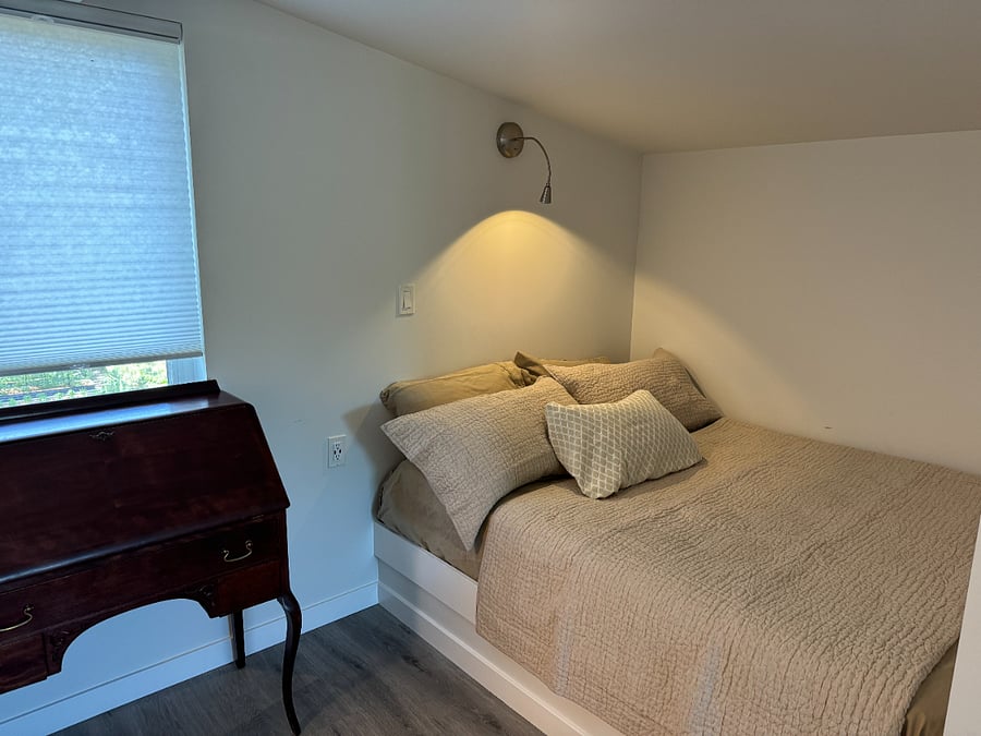 Second Queen bed in its own cozy nook with reading light.
