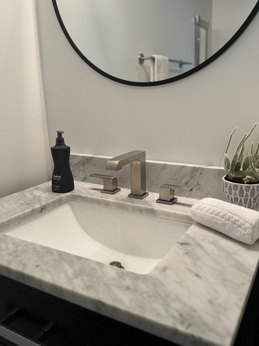 Spa like bathroom has marble finishes and heated floors