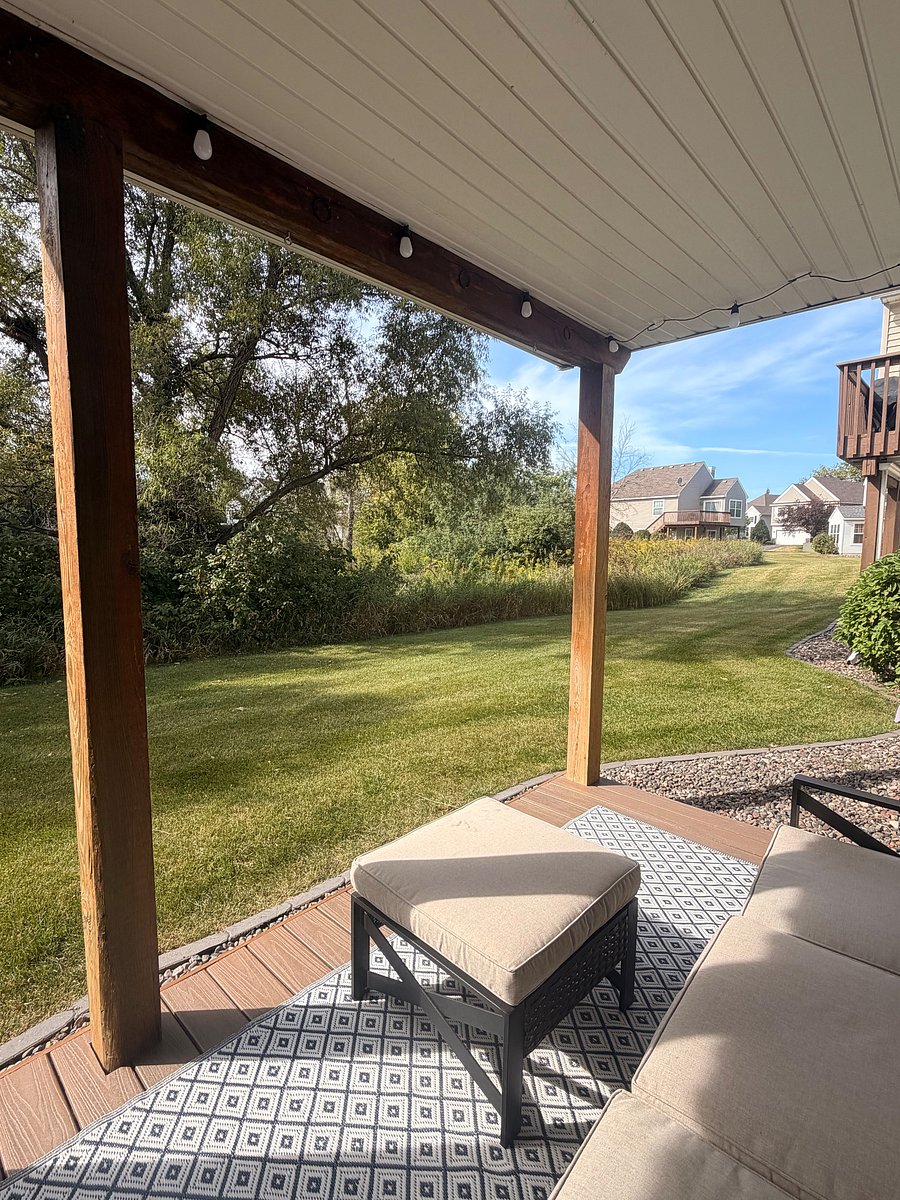 Beautiful backyard with deck and greenery