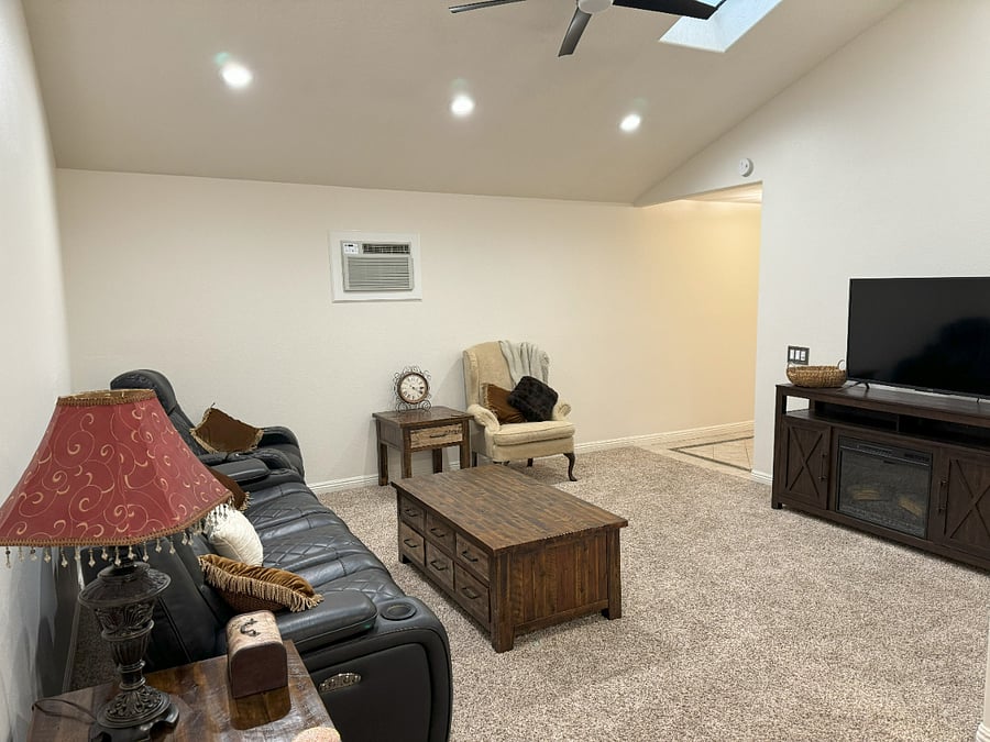 TV Console with Storage and Elect. Remote Controlled Fireplace with TV on top of it.