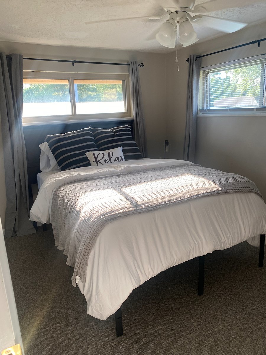 2nd bedroom with queen bed, 50 inch smart TV and full dresser.