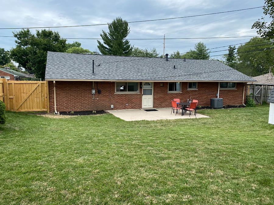 Ample backyard with full privacy fence. 