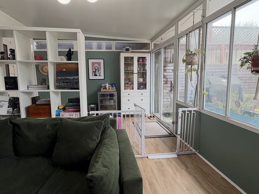 Sunroom primarily for your use. Exception = behind the open bookcase so I can access the backyard with the dogs (there is a doggy gate so they cannot access your tv area).