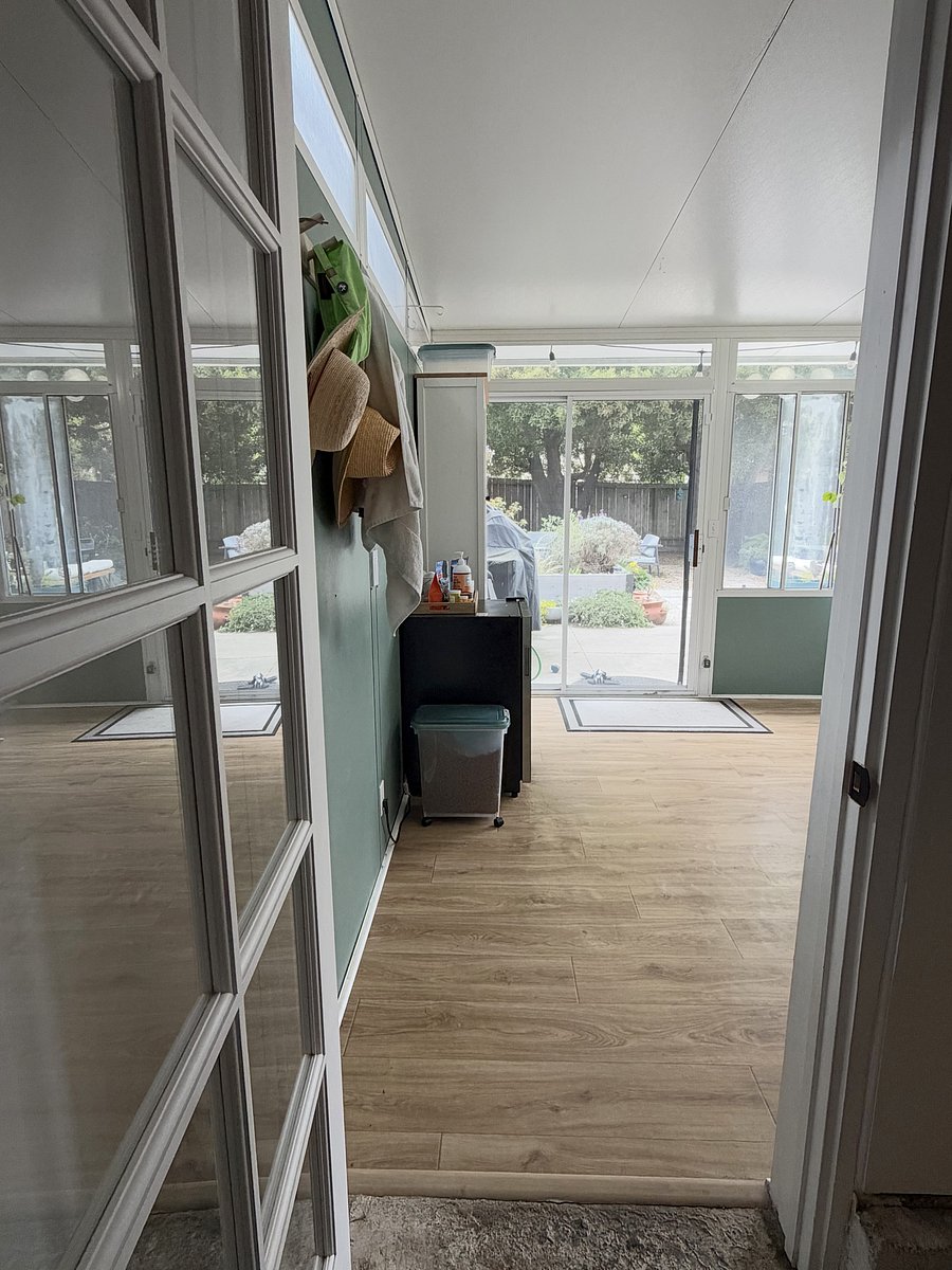 Sunroom serves as shared access area to backyard, as well as a private tv room area on the right side for you (non-shared).