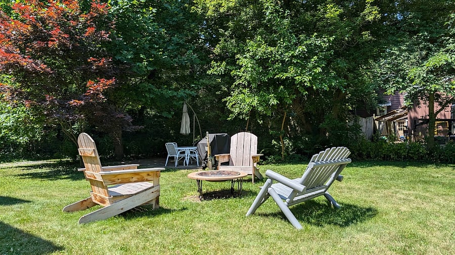 Firepit and chairs, patio, table, and chairs.