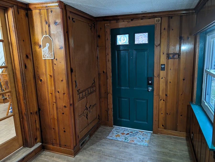 Looking at the back of the front door. Door on the left leads to the living room.