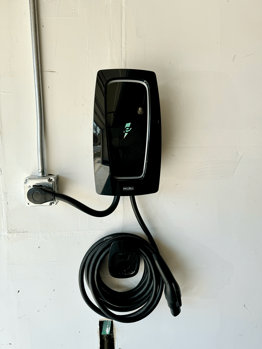 Dual Level 2 EV ChargersThe dual Electrify America Level 2 EV charger in the 2-car garage features two fast-charging ports, allowing simultaneous, efficient charging for electric vehicles. Its sleek design and advanced technology ensure quick, convenient power for two cars.
