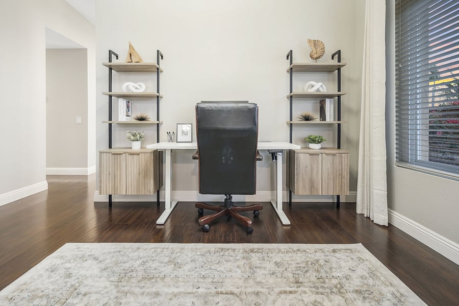 The workspace includes a 60" standing desk for versatility, a laptop monitor for dual-screen efficiency, and an ergonomic office chair for comfort. High-speed internet ensures seamless connectivity, making it perfect for working remotely.