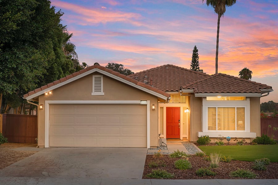 The front yard boasts beautiful landscaping with lush greenery and vibrant flowers. A smart keyless entry adds modern convenience. The two-car garage and driveway provide ample parking and easy access. There is also plenty of street parking.
