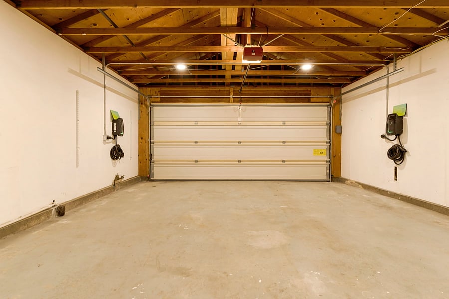The garage is equipped with dual Level 2 EV chargers, allowing for fast and efficient charging of electric vehicles. Spacious and well-organized, it accommodates two cars and provides the convenience of simultaneous charging for eco-friendly driving.