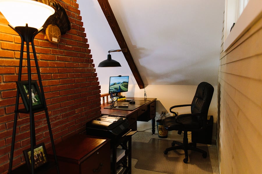 Home office tucked away into the upstairs hallway, rear wall shared with second upstairs bedroom