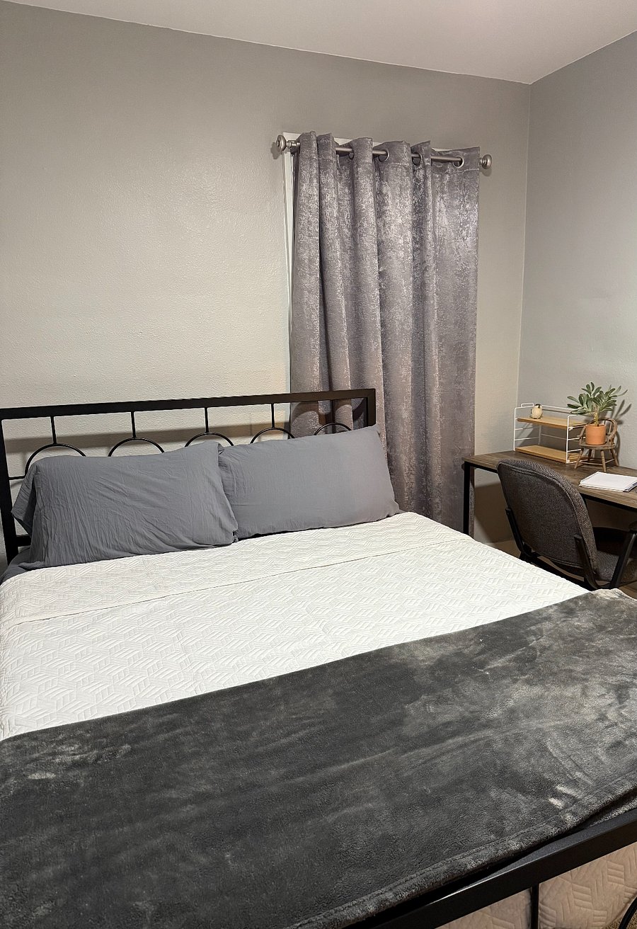 Secondary bedroom with queen size bed and desk is available for convenience if you work remotely or need to catch up on office work.