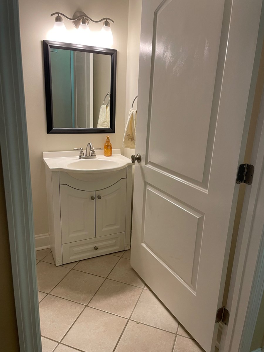 Hall bath with wide doorway that fits a wheelchair