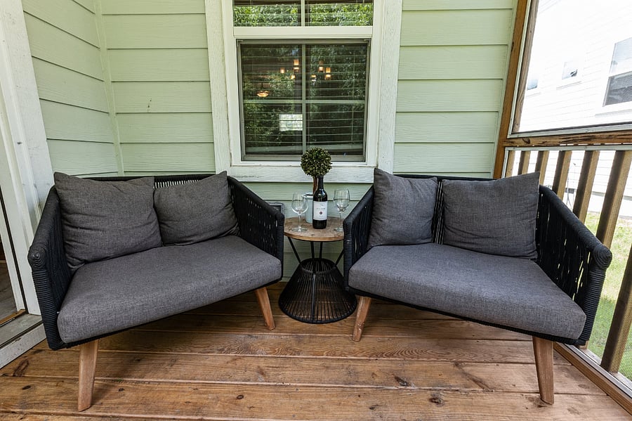 Enjoy the outdoors in this quaint screened in porch