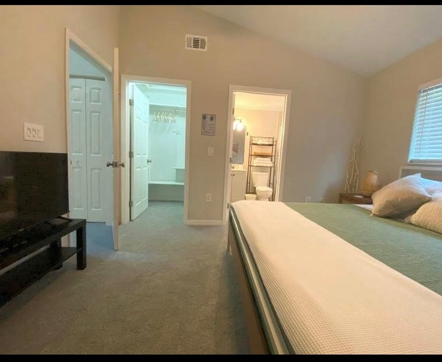 King suite with full walk in closet with storage.