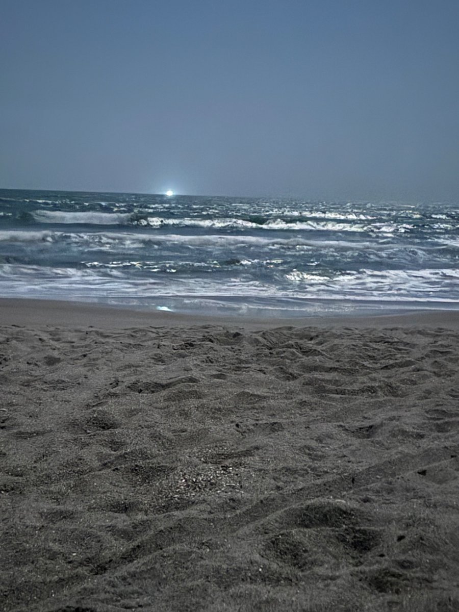 Waves reflecting the moonlight in the evening