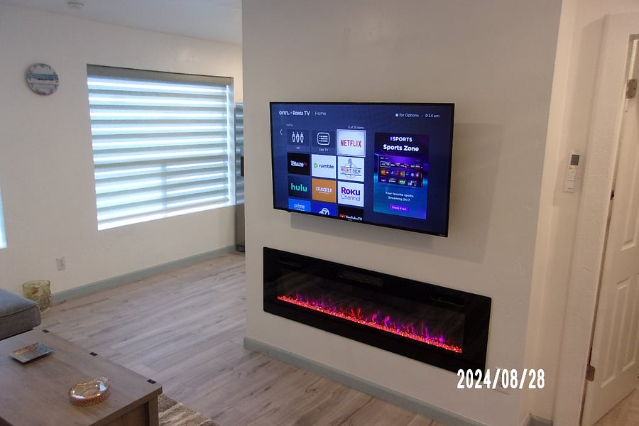 living room smart tv and fireplace