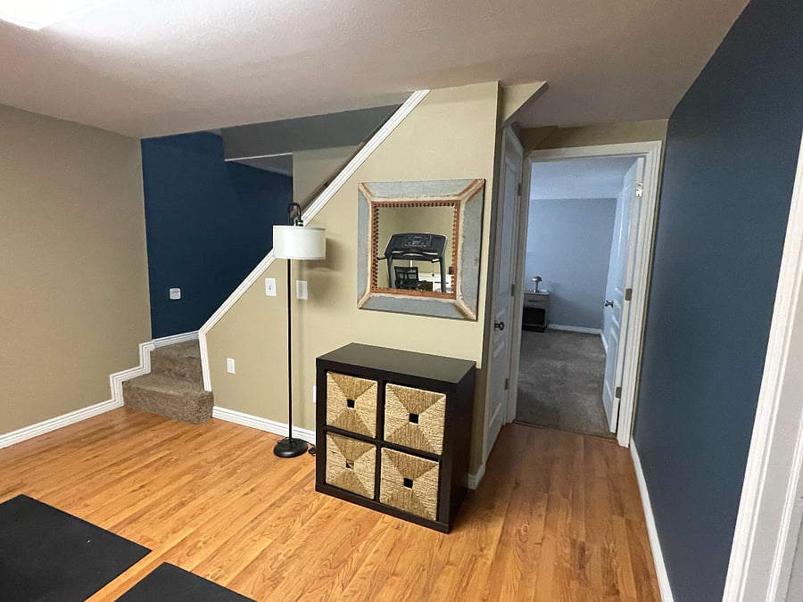 Entrance to basement bedroom and washer/dryer room