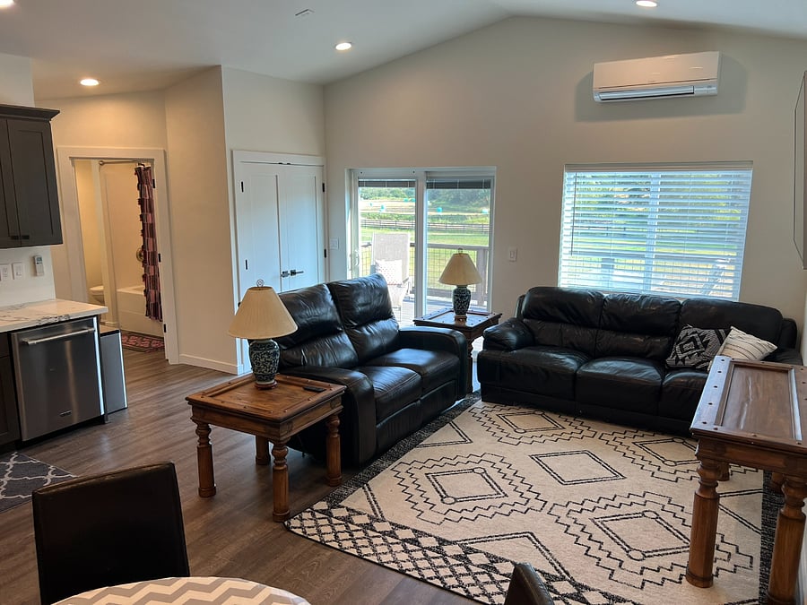 Living room area has leather furniture: full size sofa and power reclining loveseat.  60' tv with amazon firestick