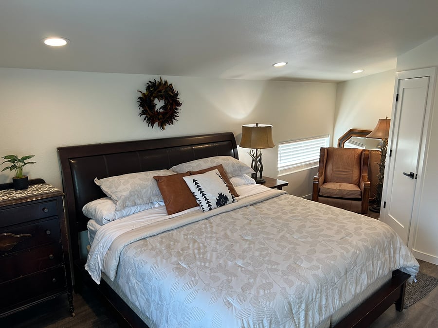 Reading nook in first bedroom with small west facing window