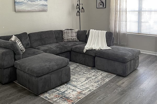 Stretch out on a cozy sectional perfect for post-shift relaxation.