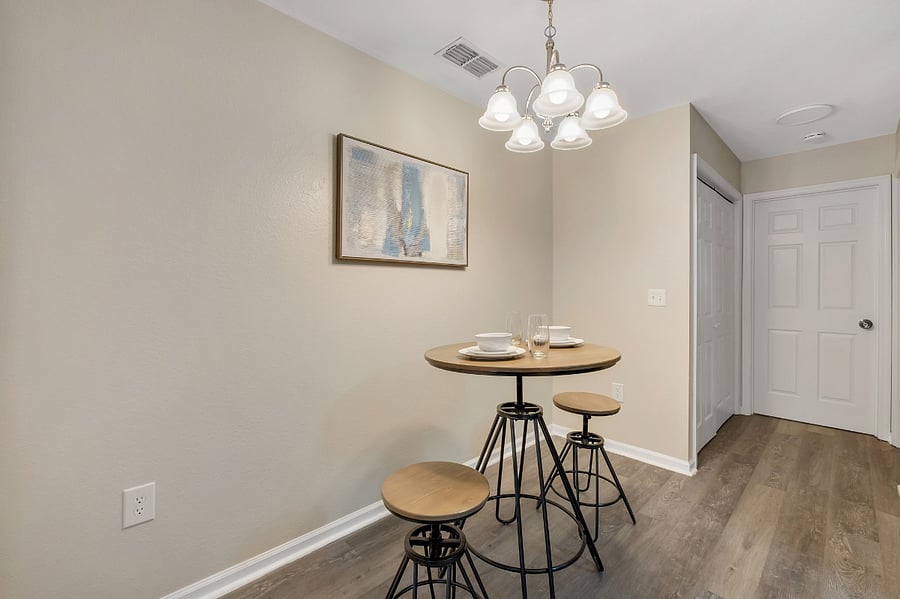 Gather for casual meals or morning coffee at the cozy bistro-style dining table.