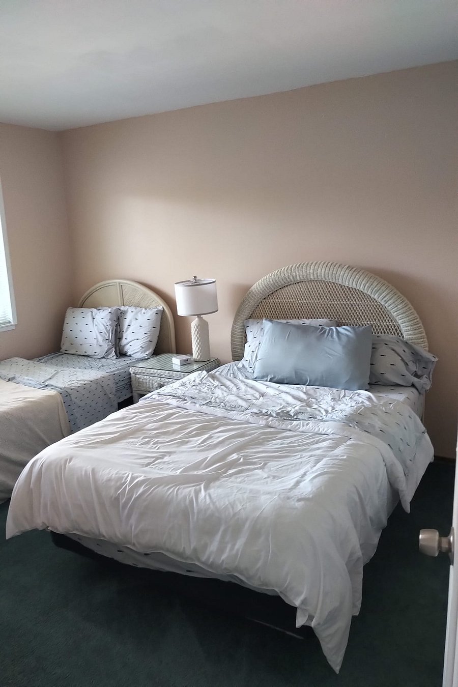 Full bed and twin xl bed in master bedroom.