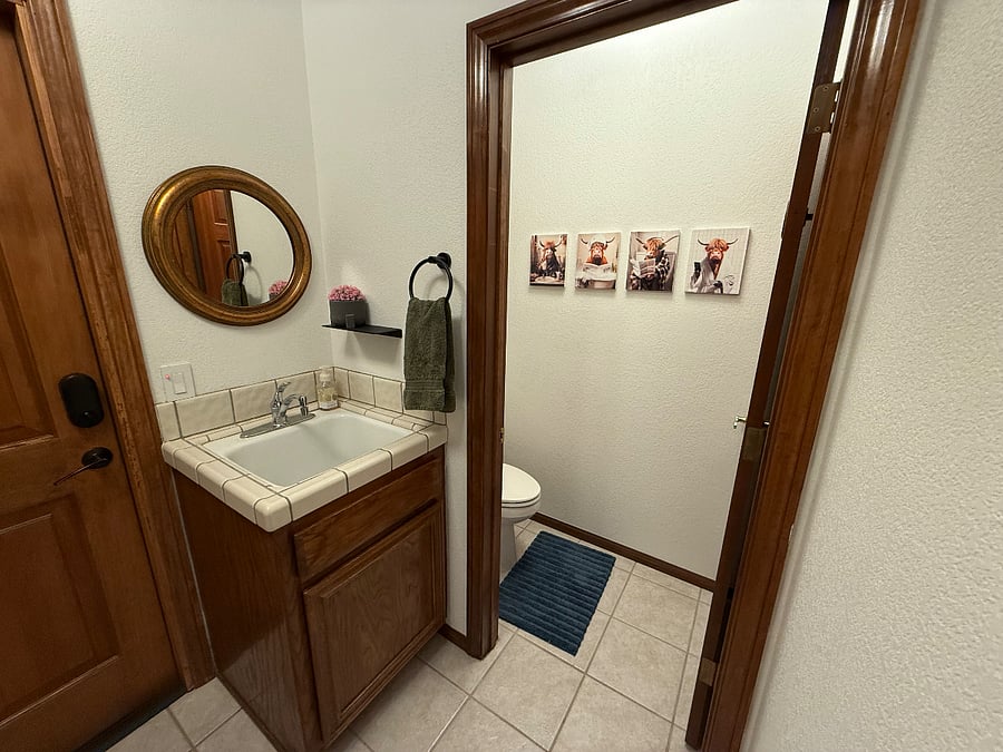 Laundry room with tub and bathroom