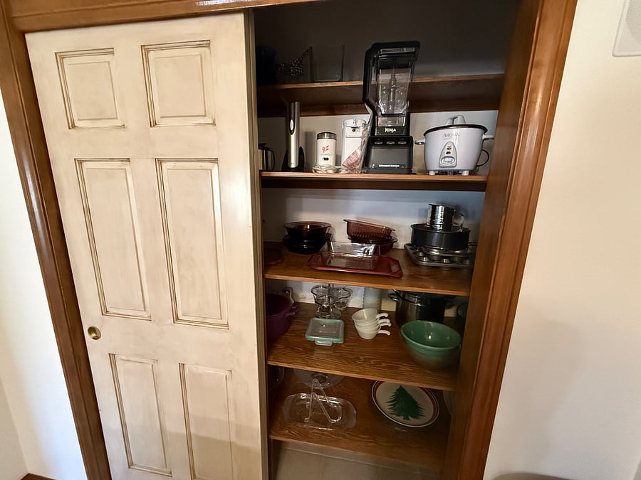 Fully stocked kitchen pantry with appliances