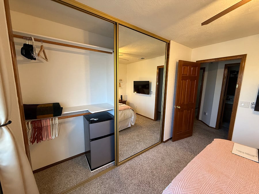 Bedroom #1 closet with mini refrigerator/freezer